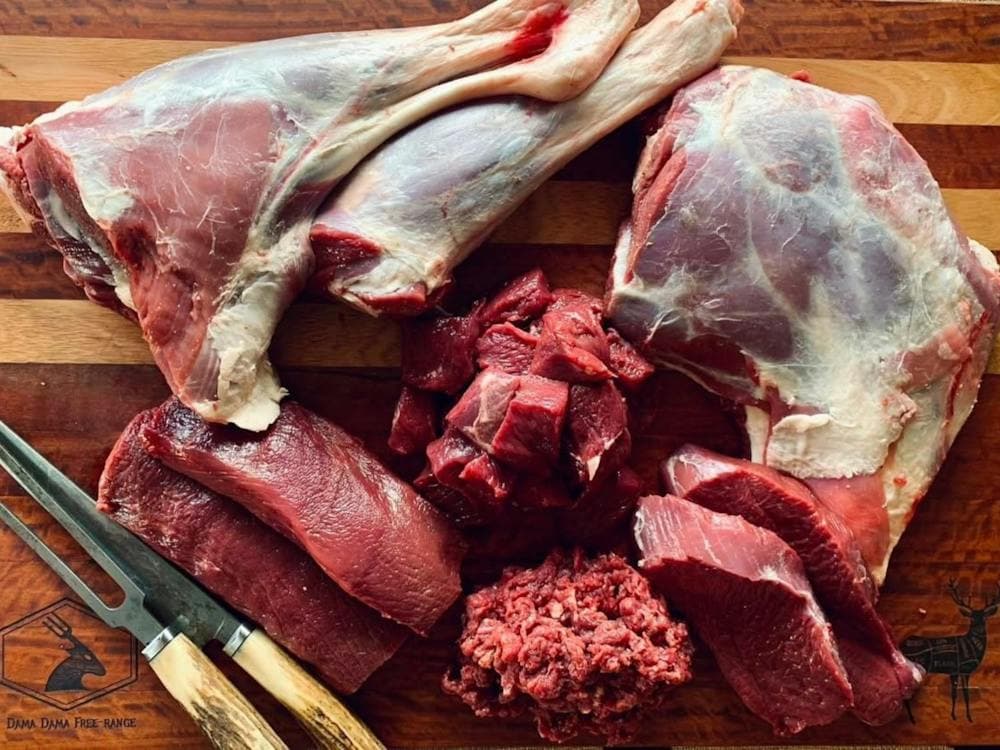 Different cuts of wild venison on a chopping board