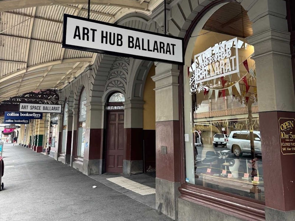 View of Art Hub building frontage with footpath of street.