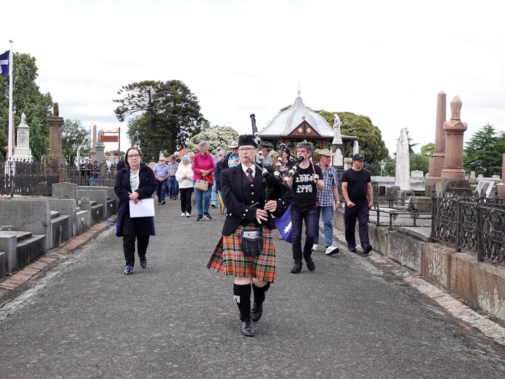 Ballarat Old Cemetery Eureka procession led by bagpipe player Sue Brant