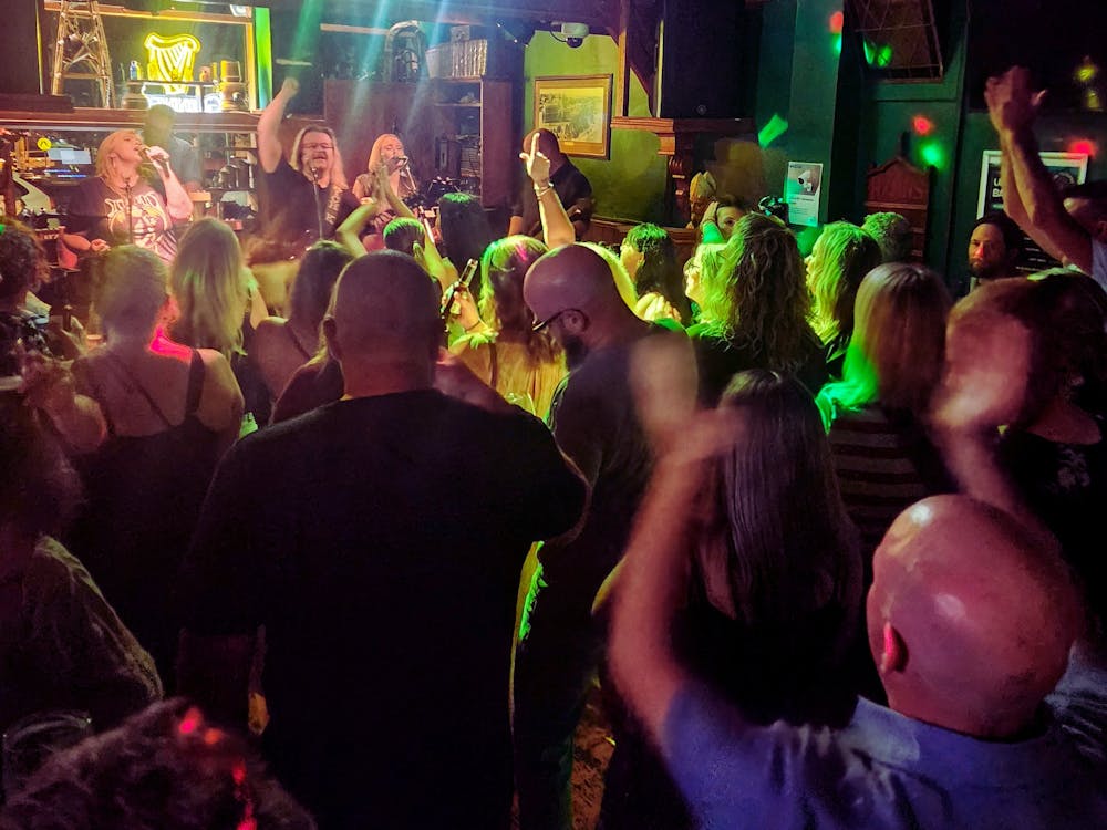 The crowd is dancing to the live music