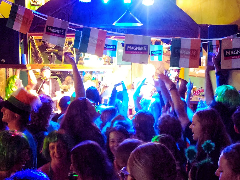 People are dancing on the dancefloor on St Patrick's Day