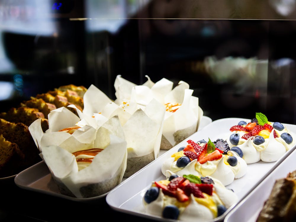 Cakes and slices presented in a display fridge..