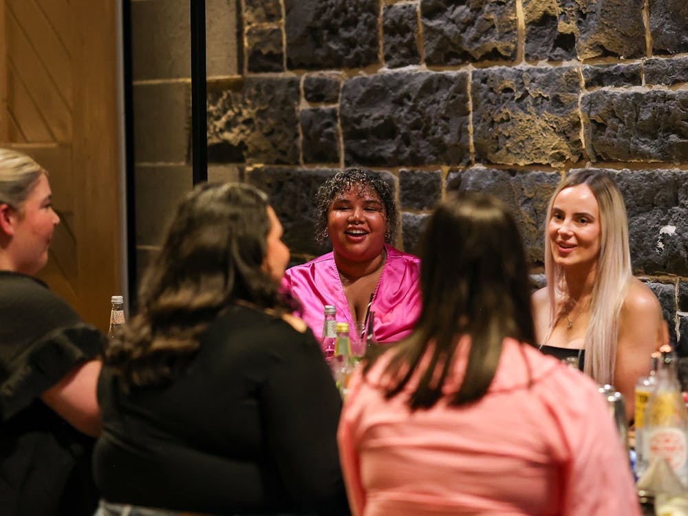 group of women seated at a table at Itinerant Spirits cocktail making class