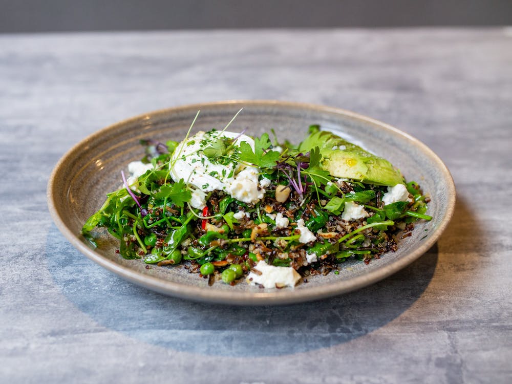 Webster's Seasonal Greens Bowl with fresh greens and grains.