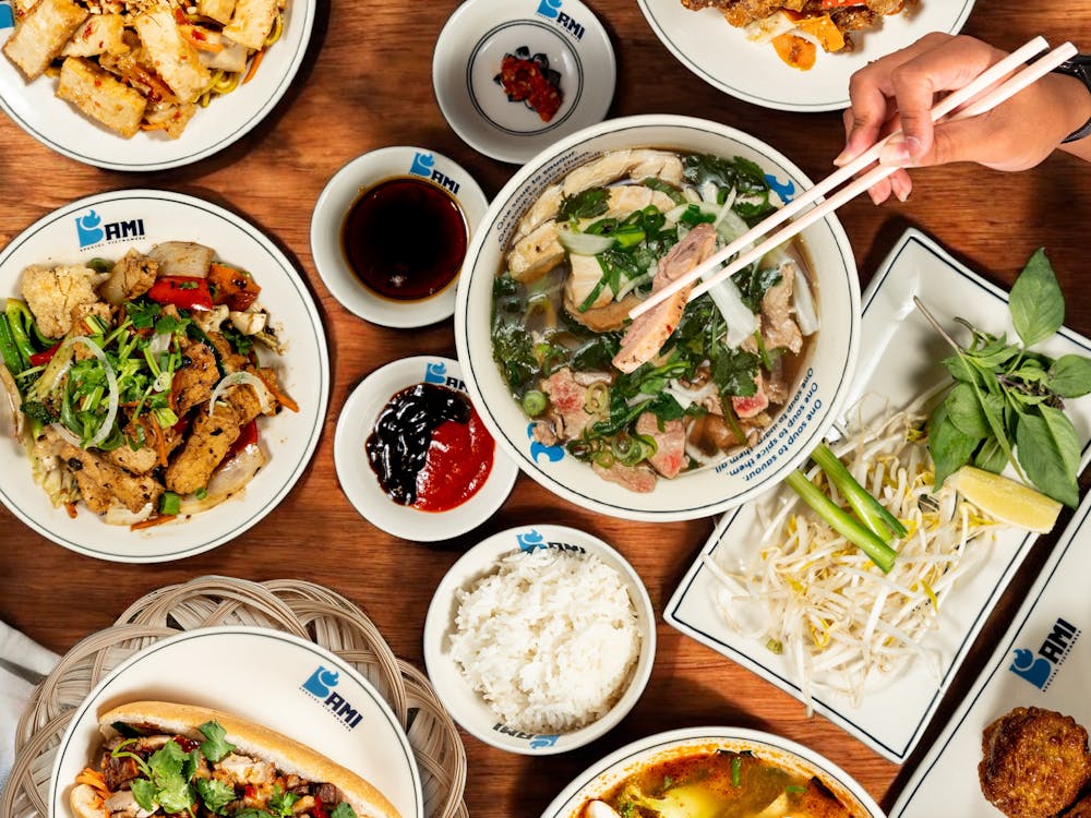 Bami Vietnamese Ballarat menu spread showing a fresh banh mi roll, pho broth bowl, and more