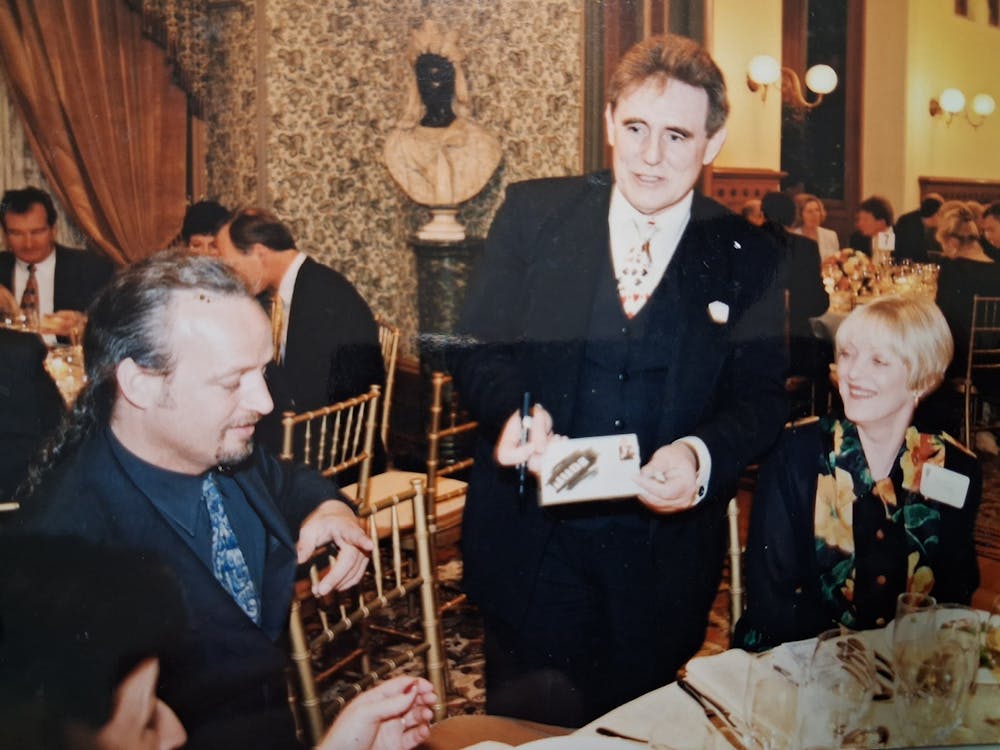 vintage images of Barry performing slight of hand at the dinnner table