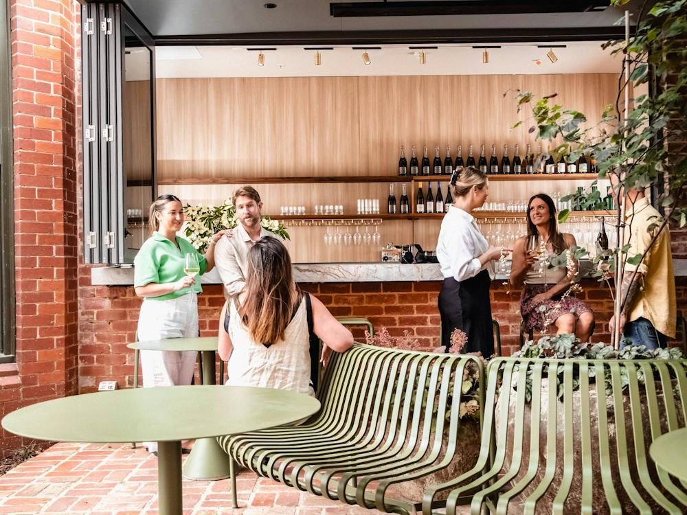 People at bar having a drink