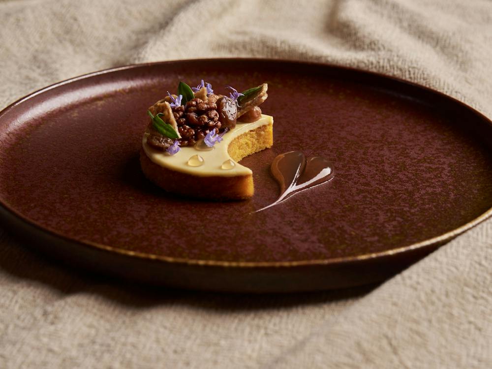 Pumpkin Cake, Crème Fraîche, Candied Boonderoo Walnuts, Sultanas, Pumpkin Seed Nougatine, Maple Gel