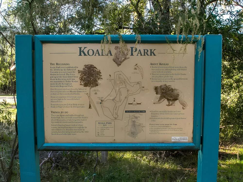 Large interpretation sign with infographics and written copy talking to the history of Koala Park