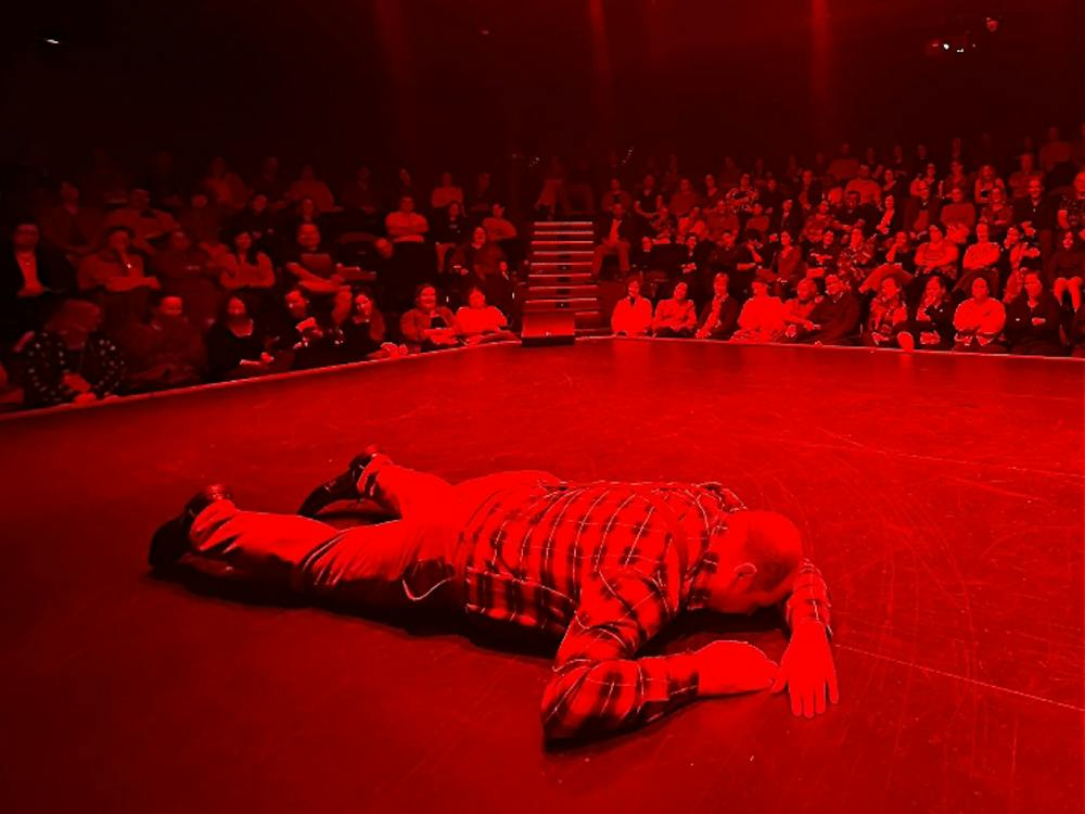 Actor lying facedown on the floor