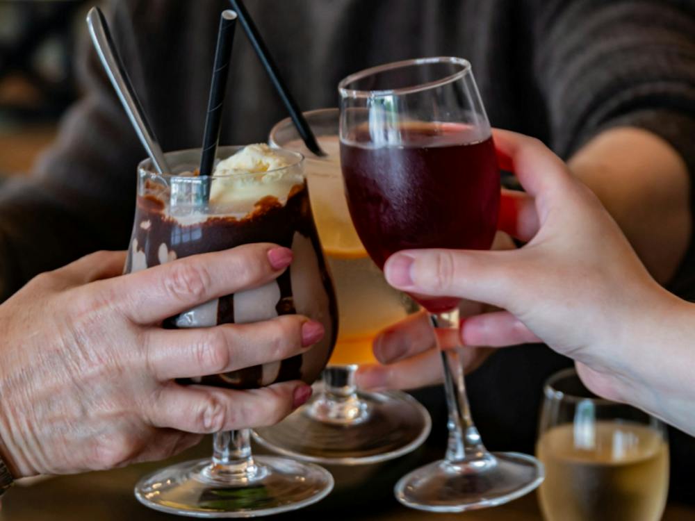 Three drinks are being toasted