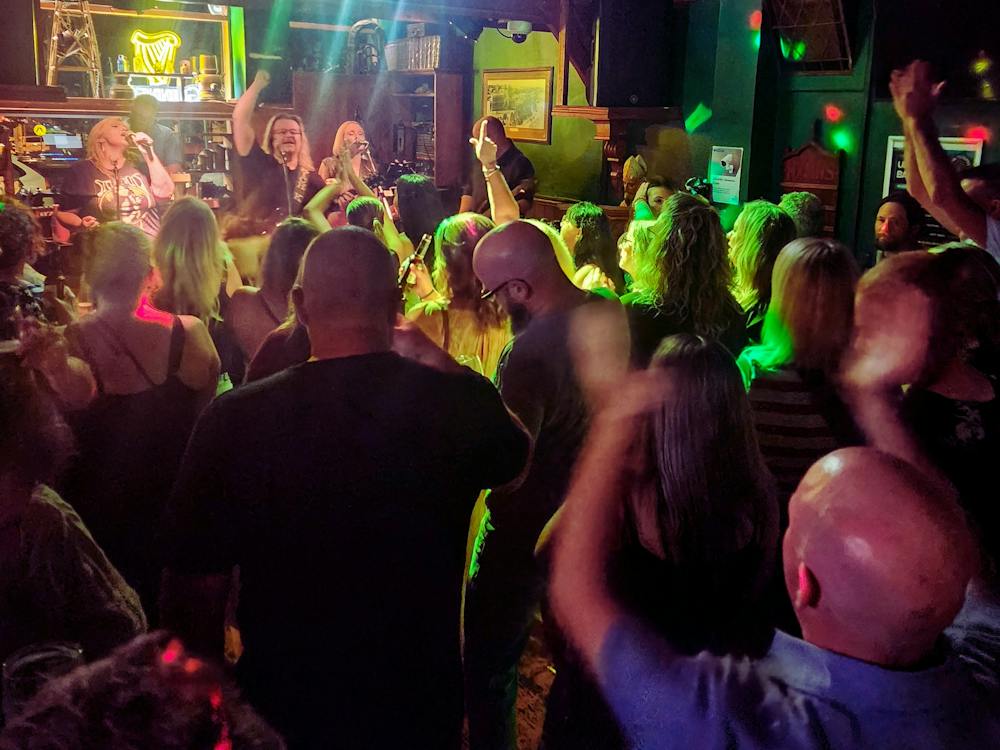 The crowd is dancing to the live music