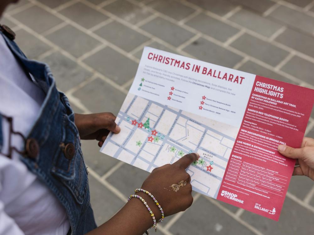 Child pointing at map