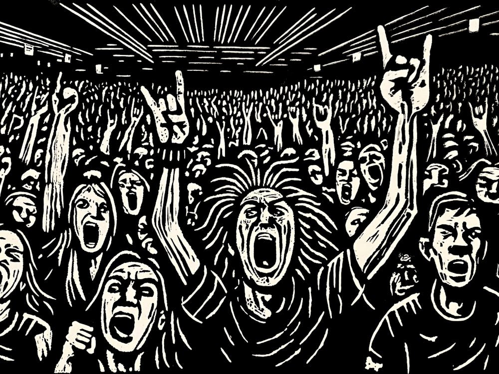 Black & White print of a crowd at a rock show.