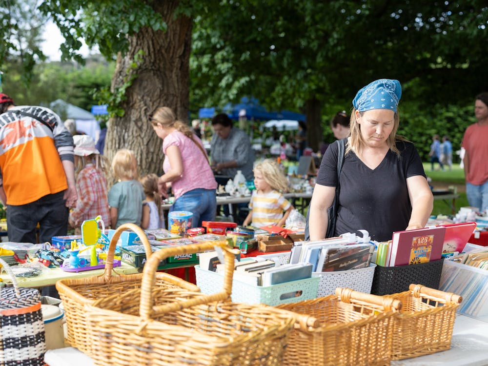 People browsing a market stall
